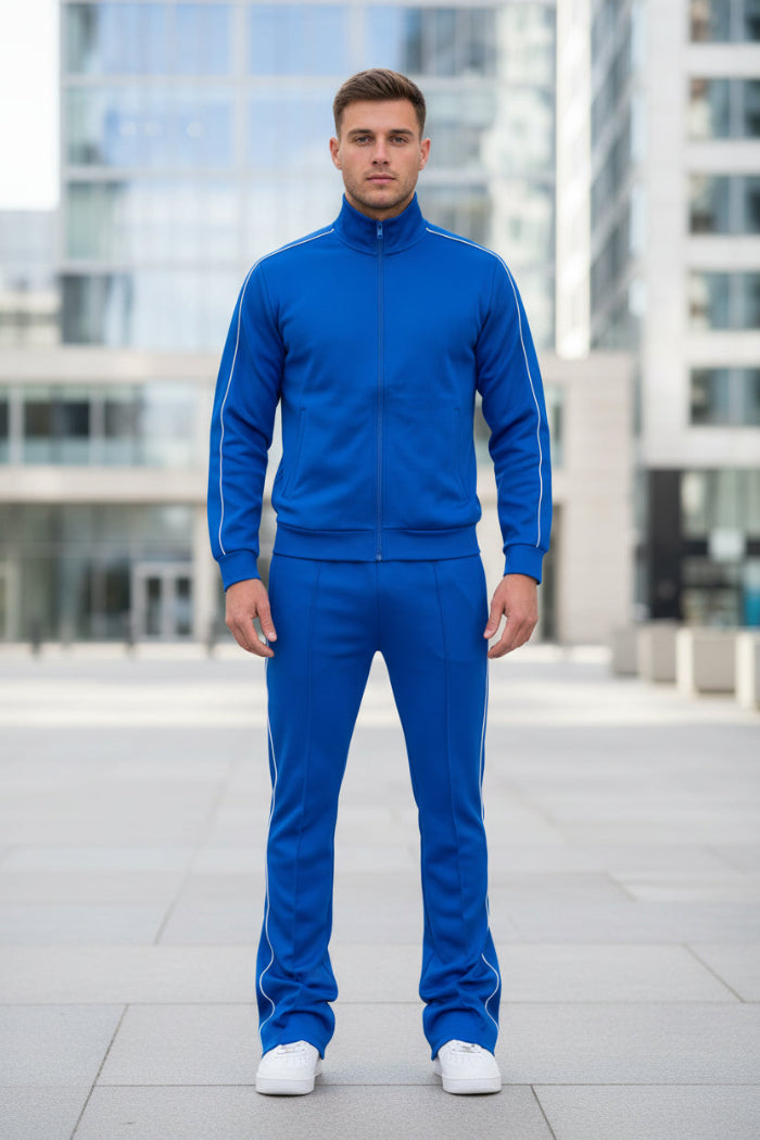 Person wearing a blue tracksuit with white stripes  taken outside