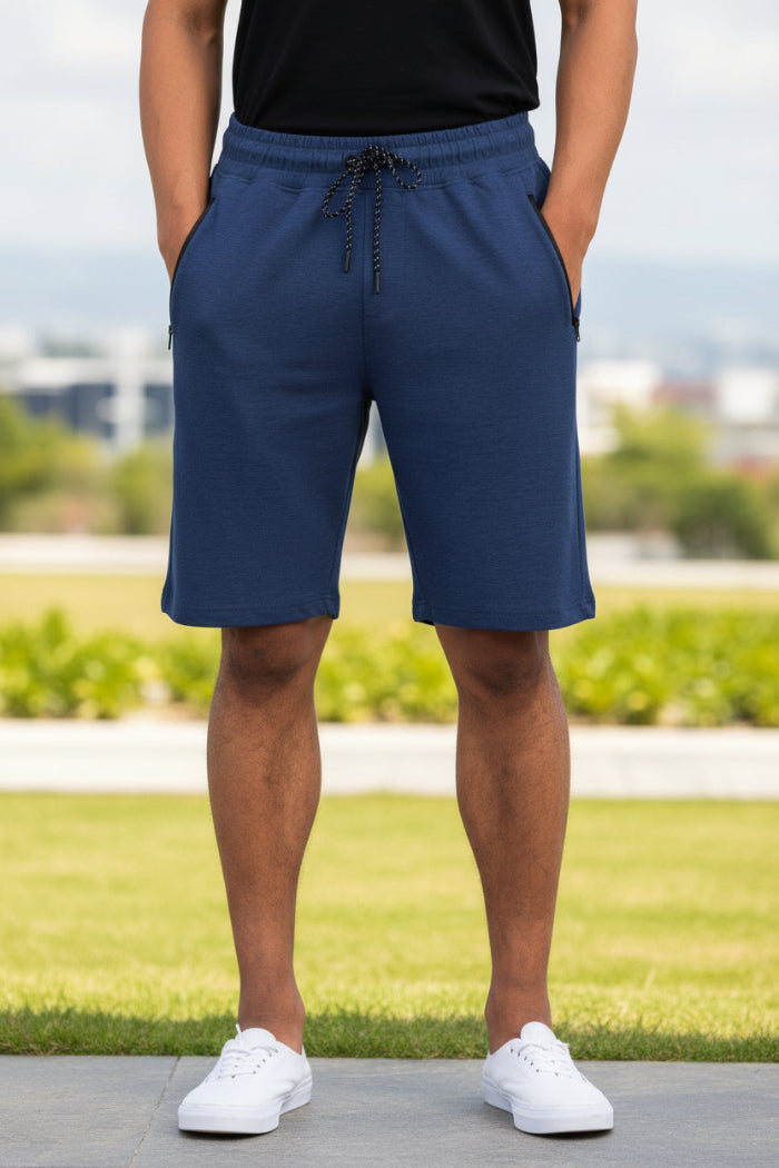 Person wearing blue shorts on a white background