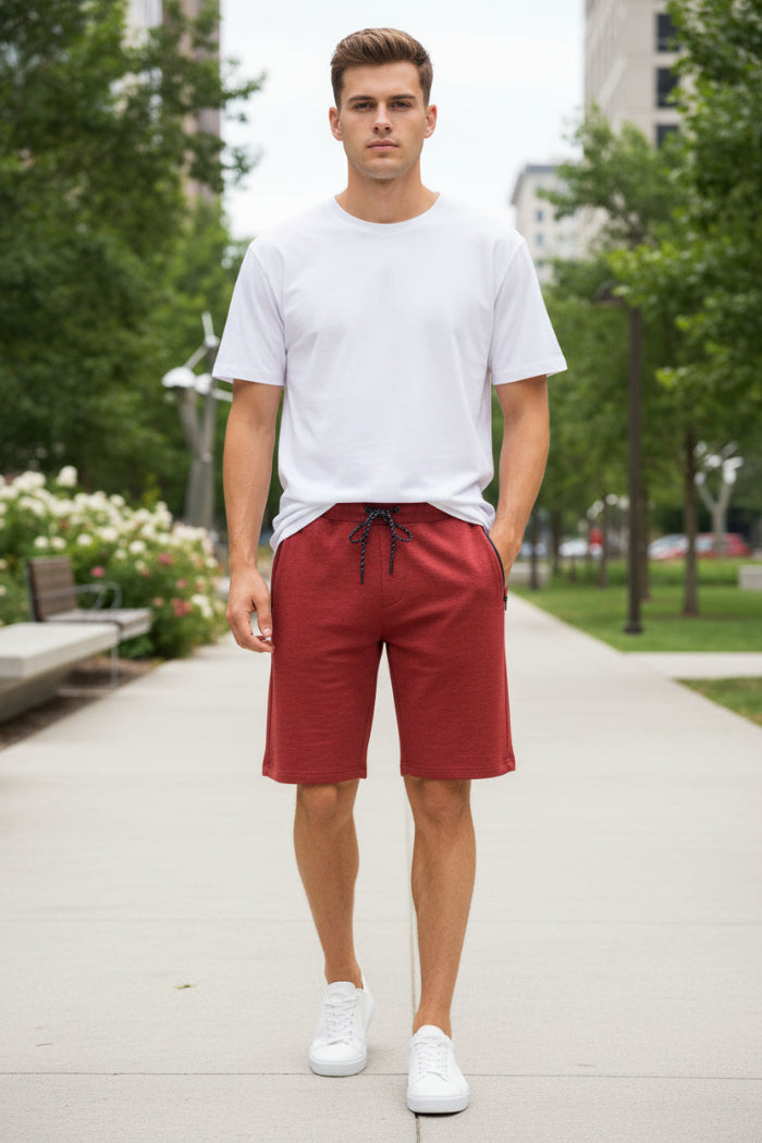 Red shorts worn by a person on a white background