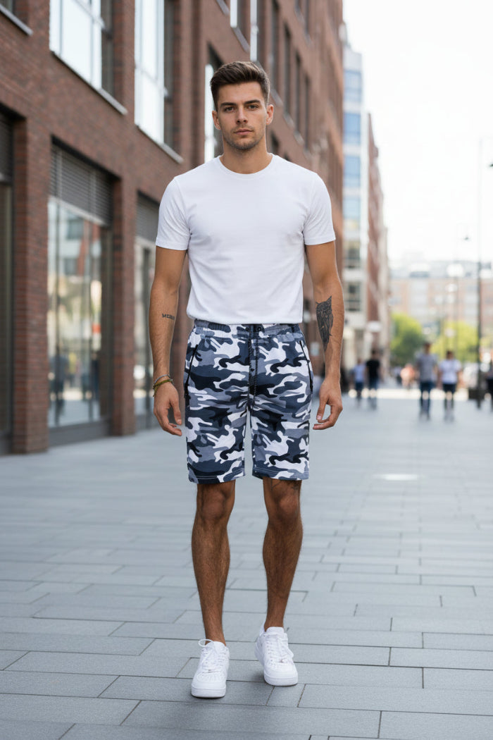 Person wearing camouflage shorts on a white background