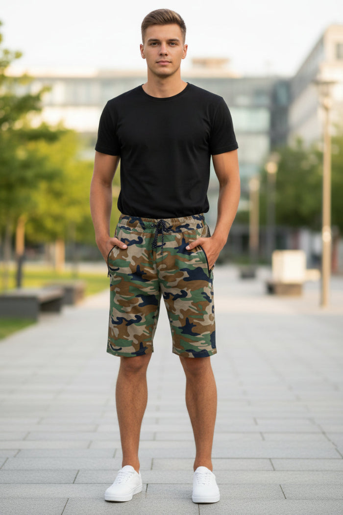 Camouflage shorts worn by a person on a white background
