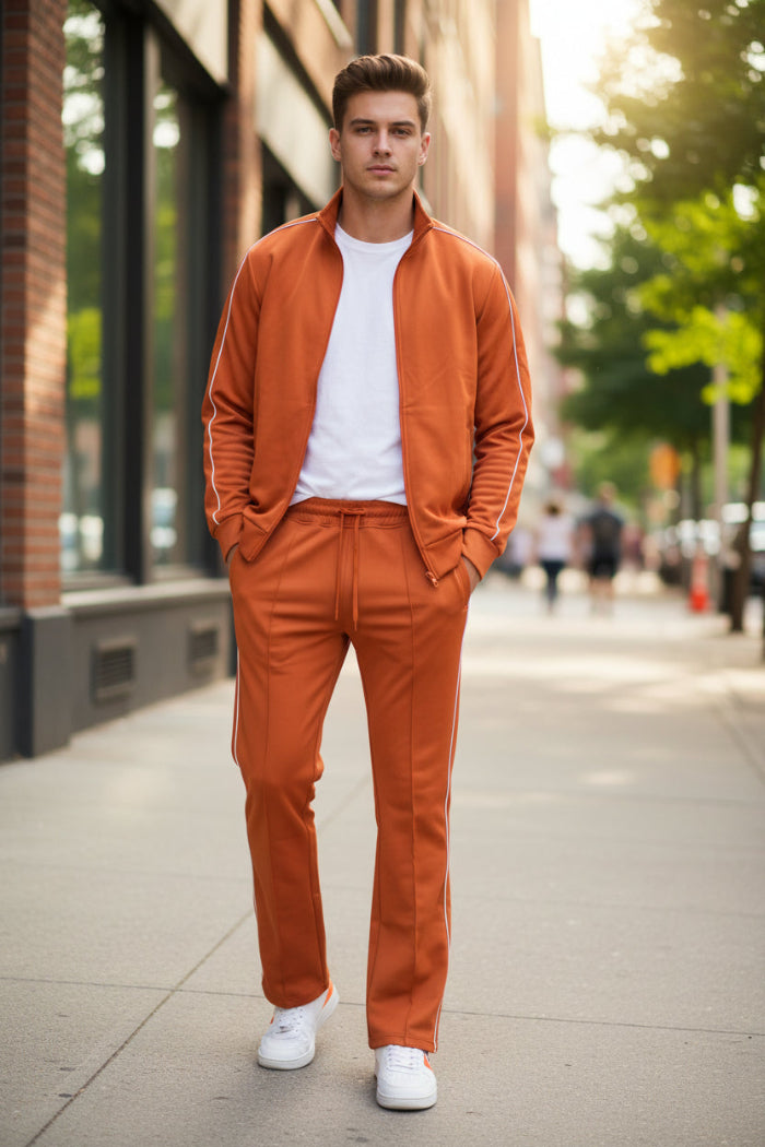Orange tracksuit with white piping on a  outside