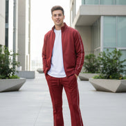 Red tracksuit with white piping on a  outside