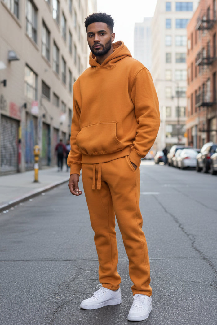 Person wearing an orange tracksuit outside