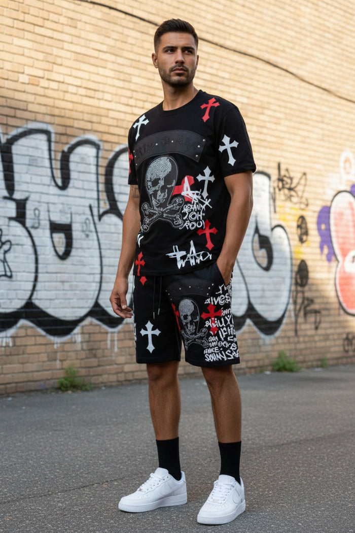 Man wearing a black outfit with skull and crossbones design  outside