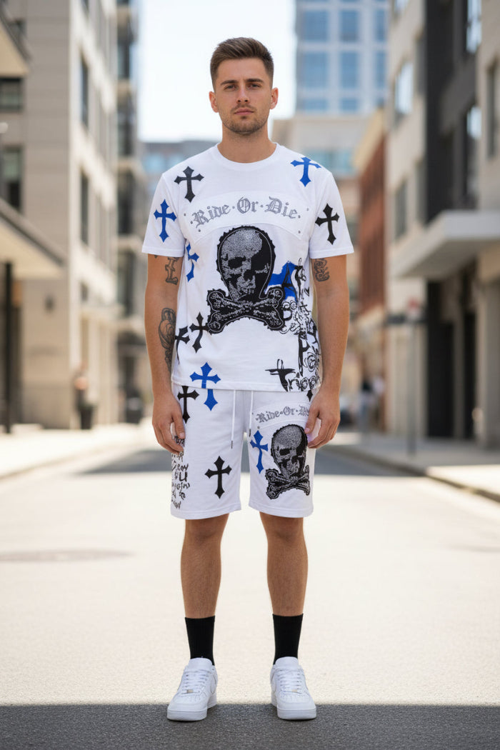 Man wearing a white t-shirt and shorts with graphic designs  outside