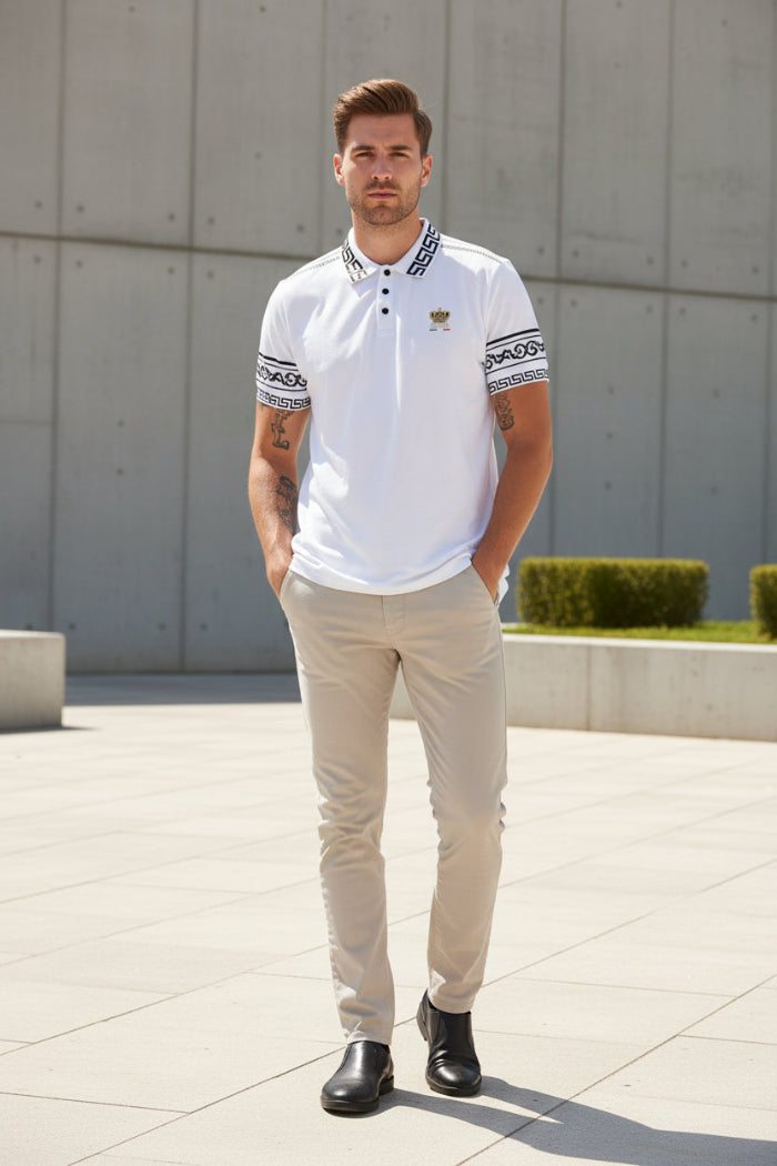 White polo shirt with black and gold details worn by a person on a white background