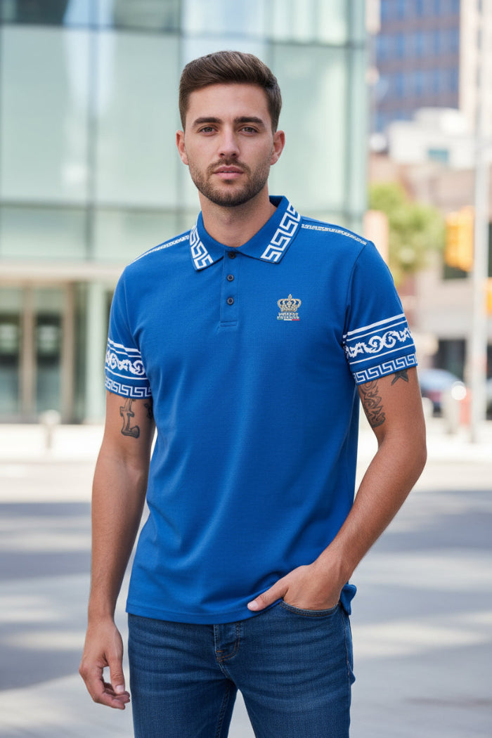 Man wearing a blue polo shirt with white patterns on a white background