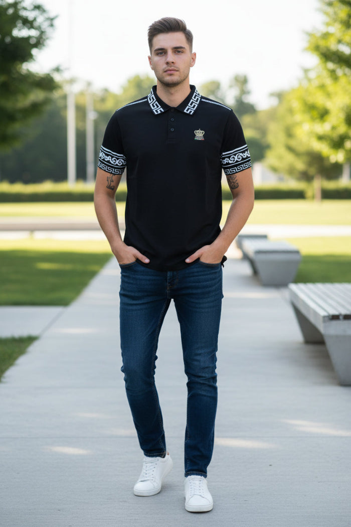 Black polo shirt with white patterns on sleeves and collar, featuring a logo, worn by a person.