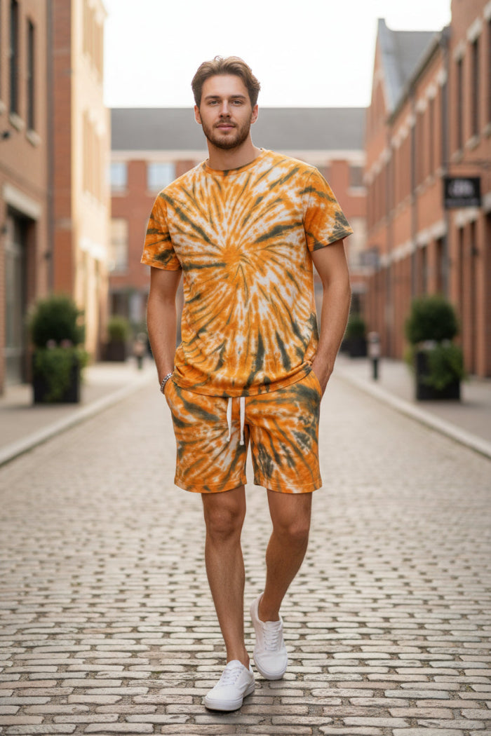 Person wearing a tie-dye outfit with orange and black pattern  outside