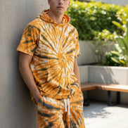 Tie-dye t-shirt and shorts set with orange and black pattern  outside