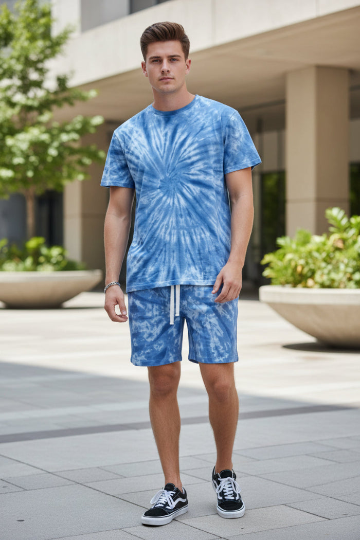 Person wearing a blue tie-dye shirt and shorts set  outside