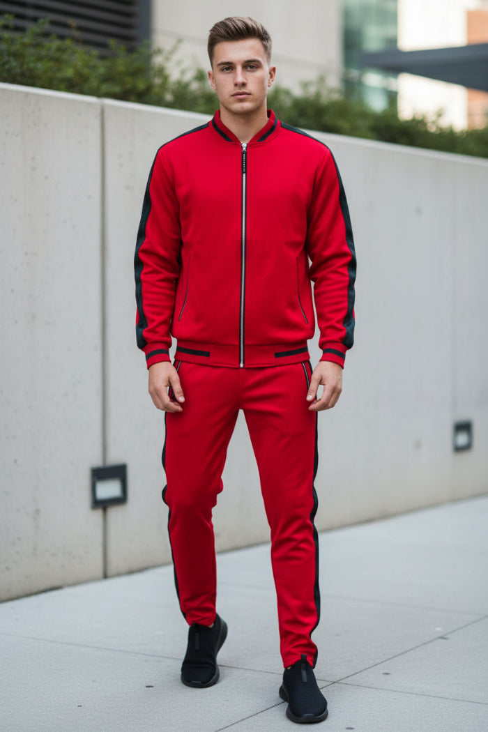 Person wearing a red tracksuit with black accents picture taken outside