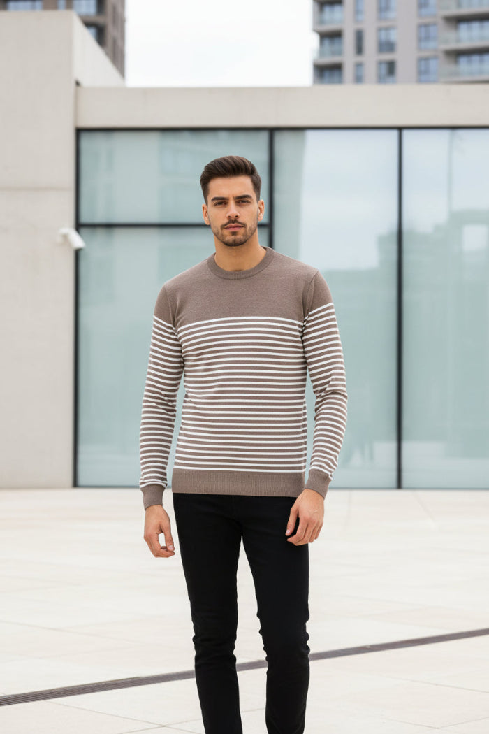 Man wearing a brown and beige striped sweater on a white background