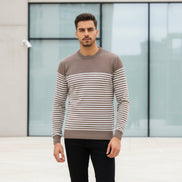 Man wearing a brown and beige striped sweater on a white background