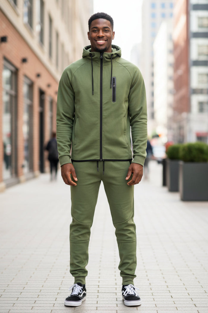 Man wearing a green tracksuit outside