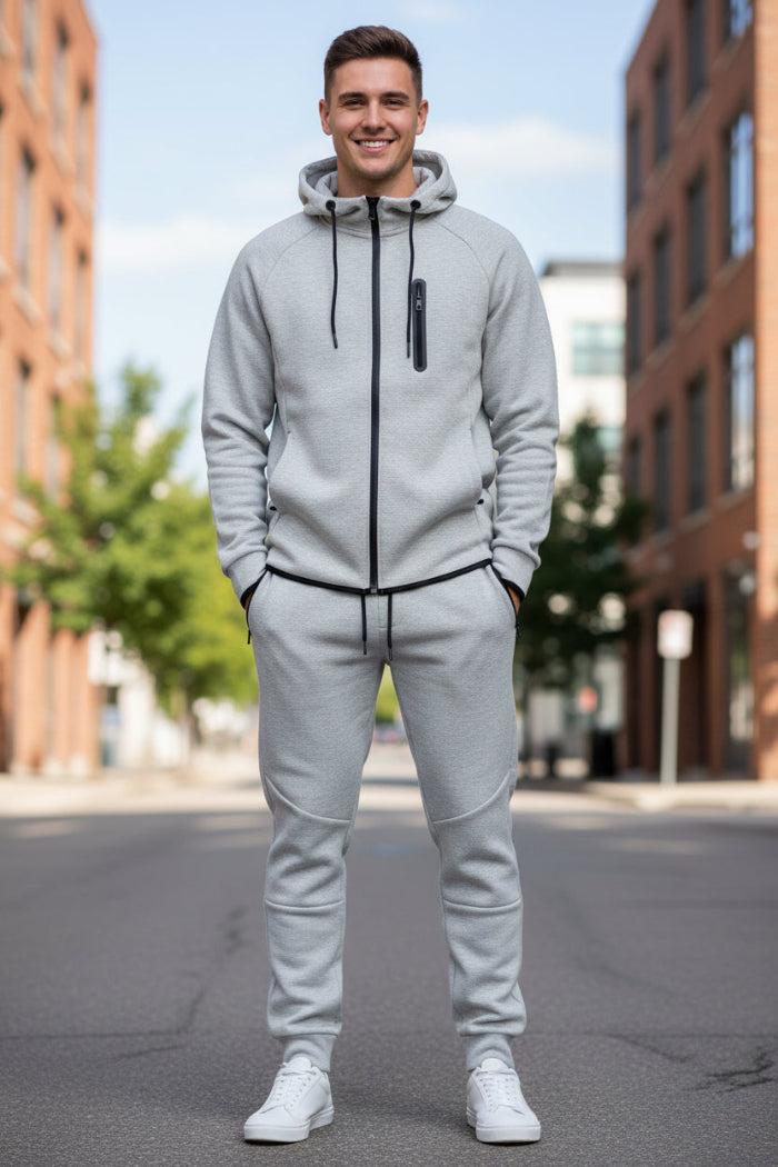 Man wearing a gray tracksui taken outside