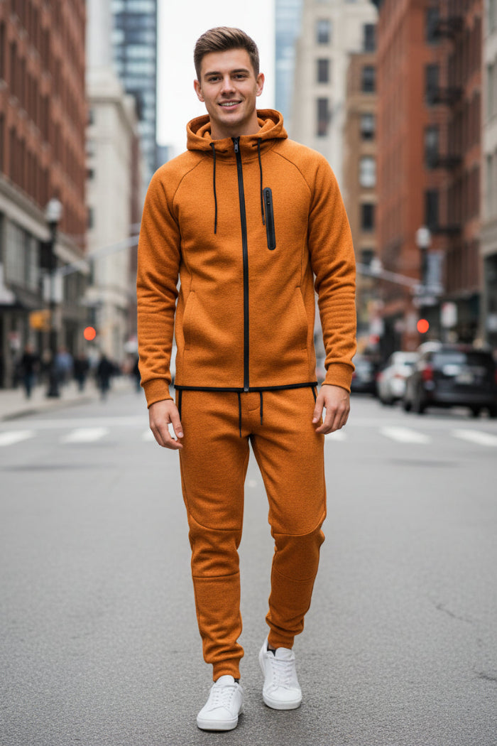 Man wearing an orange tracksuit taken outside