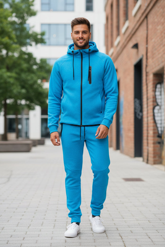 Person wearing a blue tracksuit taken outside