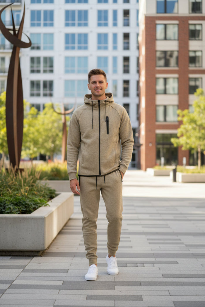 Man wearing a beige tracksuit taken outside