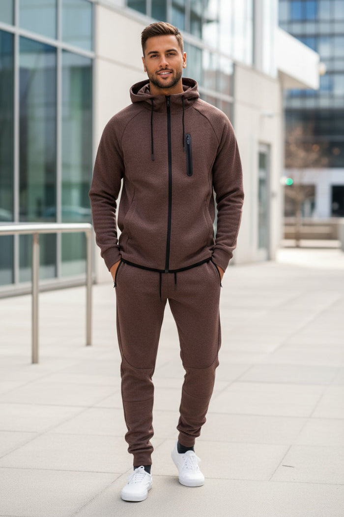 Man wearing a brown tracksuit taken outside