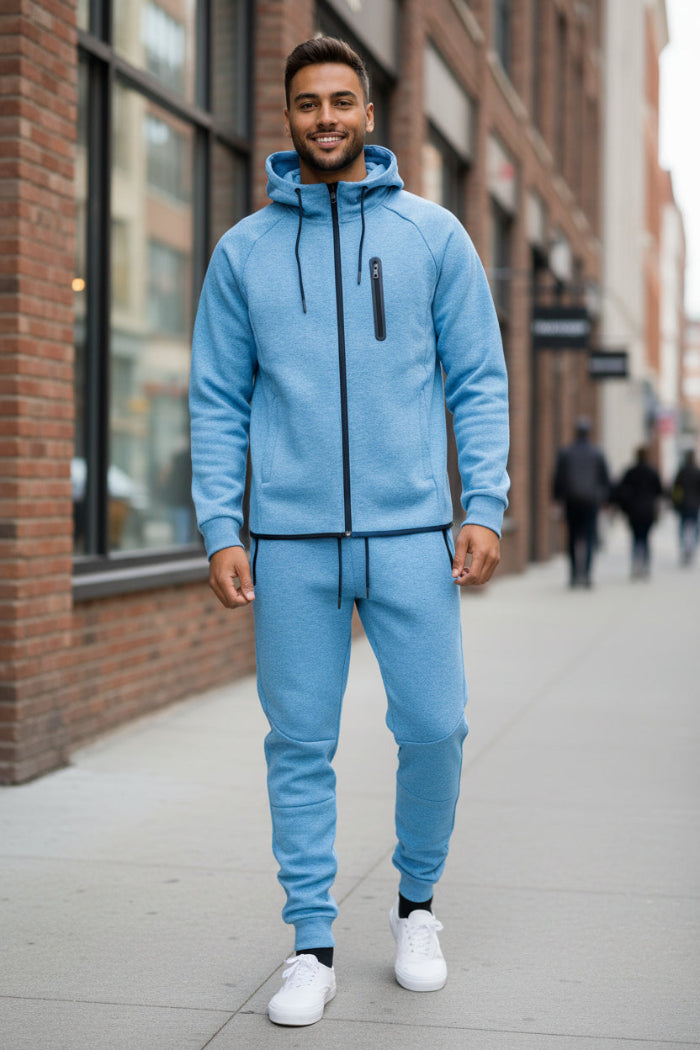 Man wearing a blue tracksuit on taken outside