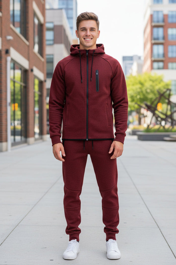 Man wearing a maroon tracksuit taken outside