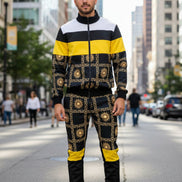 Man wearing a black and yellow patterned outfit taken outside