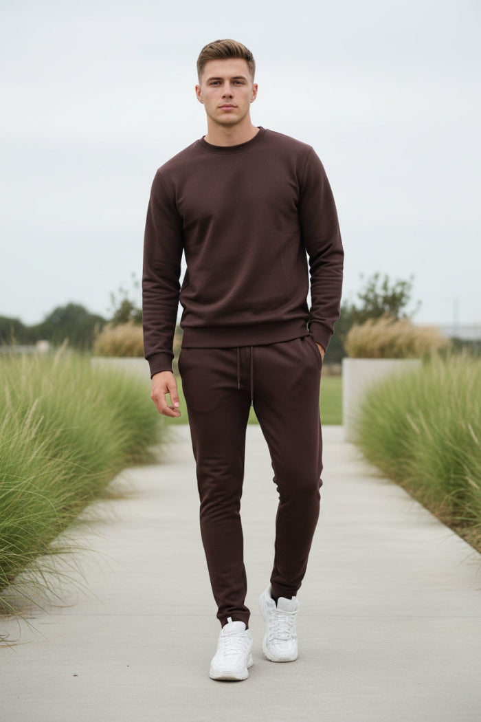 Man wearing a purple tracksuit taken outside