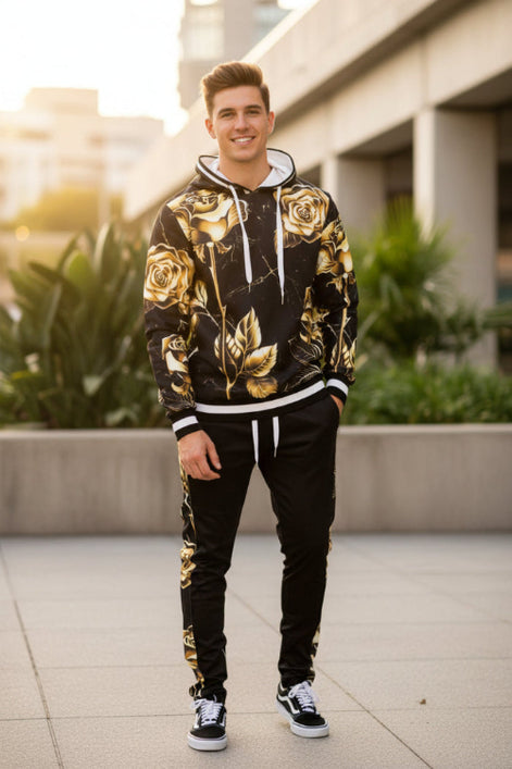 Man wearing a black hoodie with gold floral patterns  taken outside