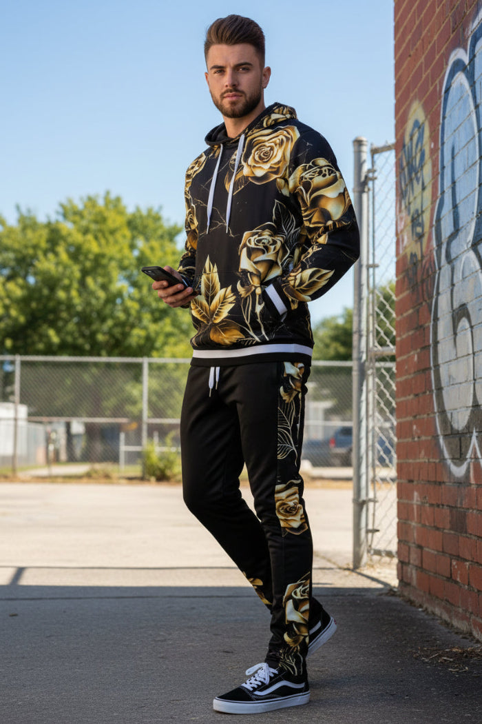 Man wearing a black and gold floral tracksuit  taken outside