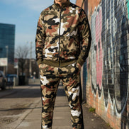 Person wearing a camouflage tracksuit  taken outside