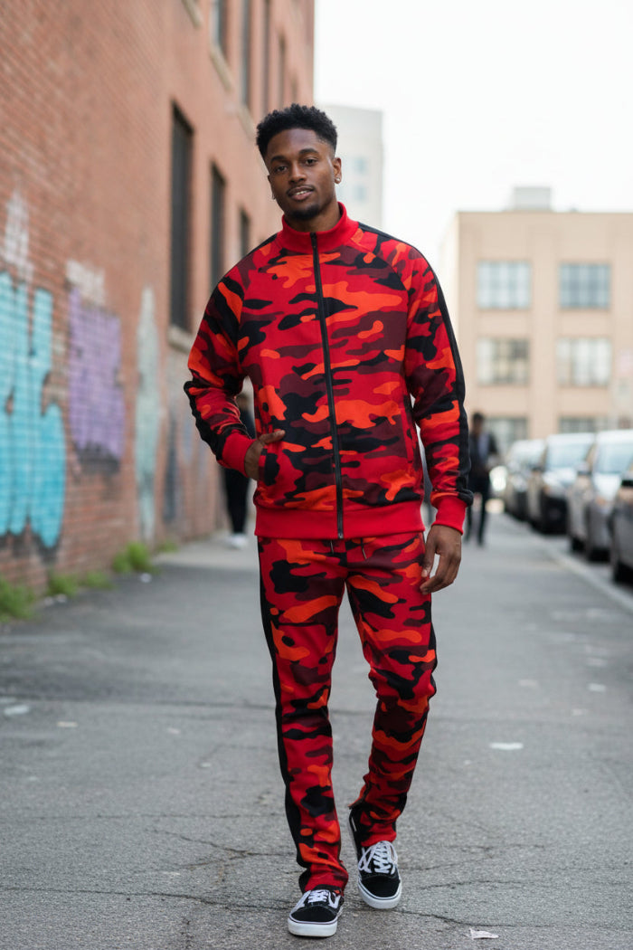 Man wearing a red and black camouflage tracksuit  taken outside