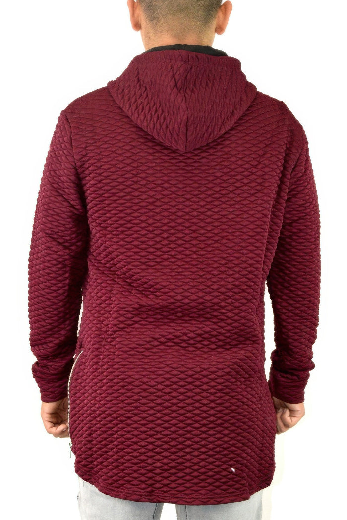 Maroon textured hoodie worn by a person on a white background
