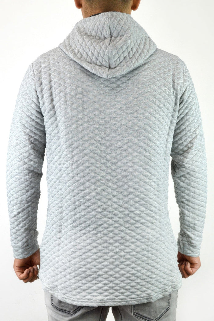 Light gray textured hoodie worn by a person on a white background