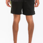 Person wearing black shorts on a white background