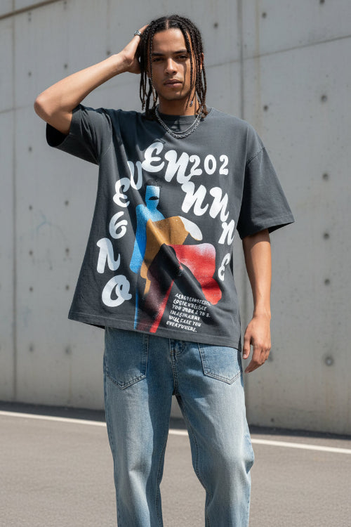 Person wearing a black t-shirt with graphic design and text