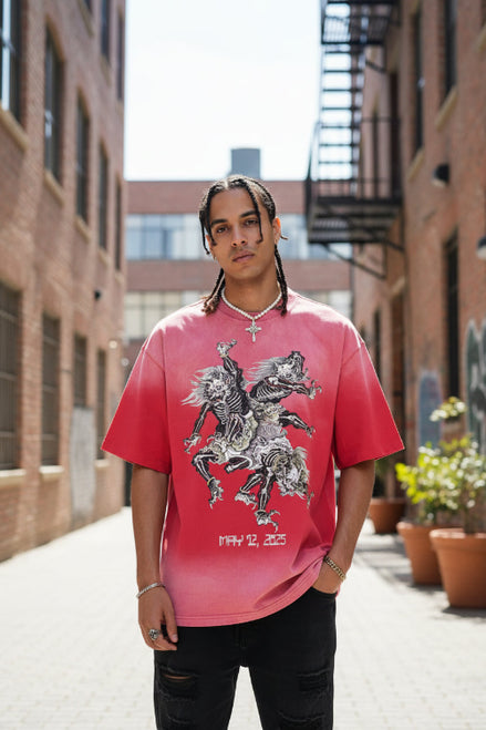 Person wearing a red t-shirt with a graphic design on a beige background