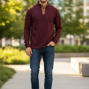 Black long-sleeve shirt with brown shoulder accents on a white background