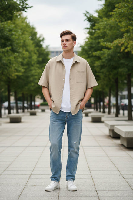 Beige shirt over a white t-shirt on a white background