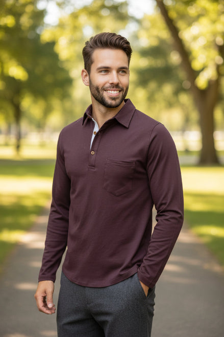 Man wearing a maroon long-sleeve shirt with a white collar on a white background
