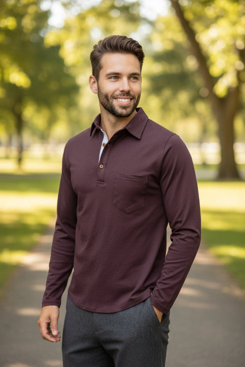 Man wearing a maroon long-sleeve shirt with a white collar on a white background