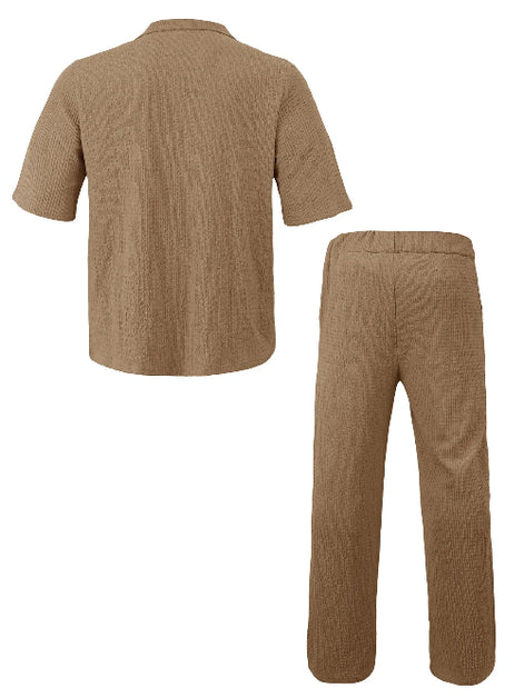 A two-piece black ribbed lounge set consisting of a short-sleeve button-up shirt and matching straight-leg pants, 