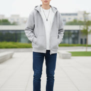 Gray hoodie worn by a person on a light gray background