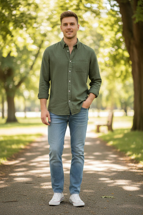 Green button-up shirt worn by a person on a white background