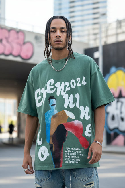 Person wearing a green t-shirt with artistic design and text