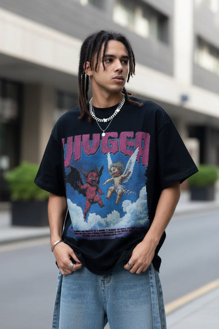 Person wearing a black t-shirt with a graphic design featuring two figures and the word 'HUGER'.