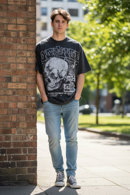 Black t-shirt with graphic design featuring a skull and text on a white background