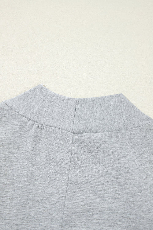 Close-up of a gray fabric texture on a beige background