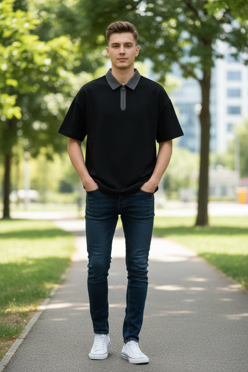 Black t-shirt with a gray collar on a light gray background